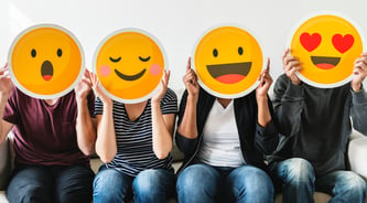 diverse-people-holding-emoticon