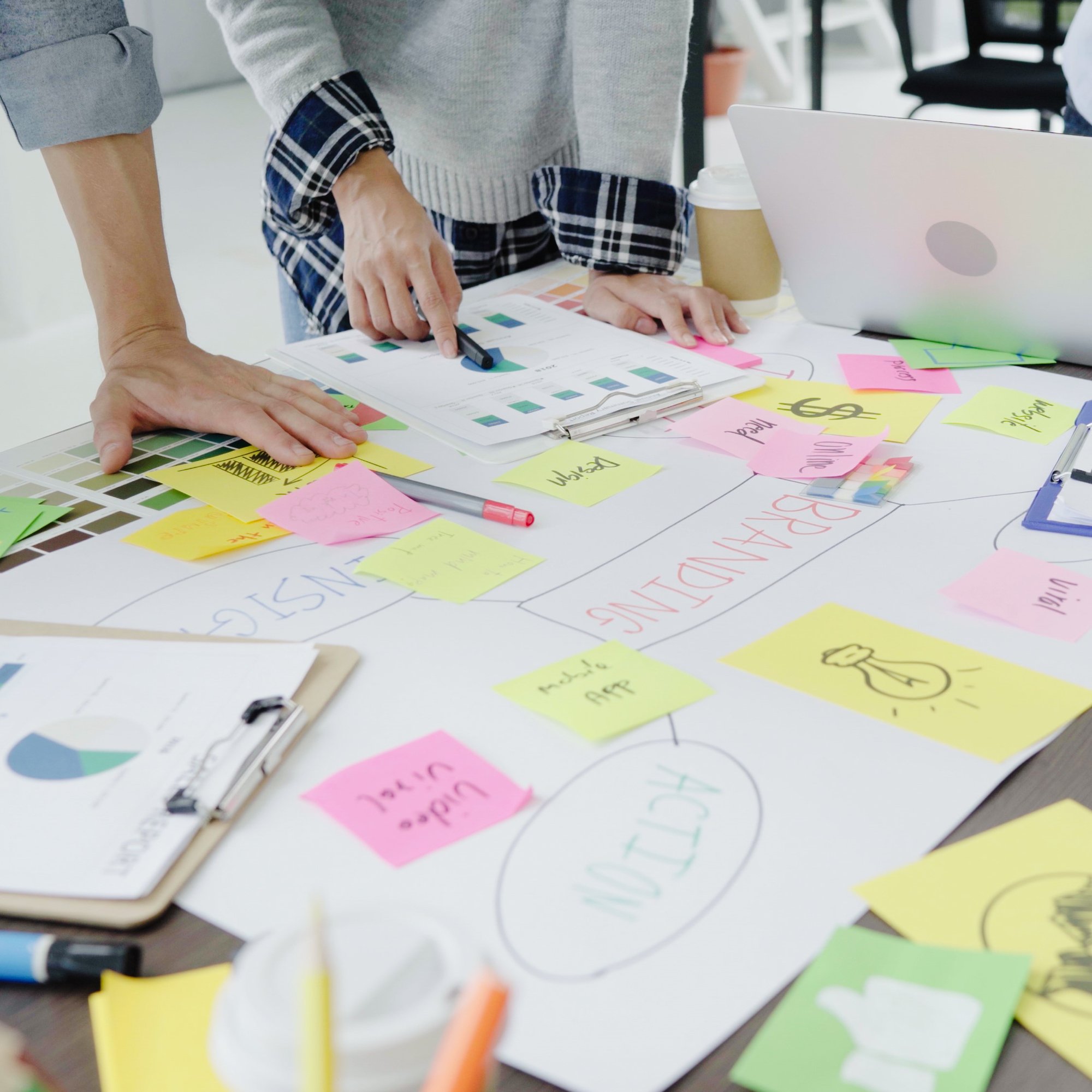 group-casually-dressed-business-people-discussing-ideas-office - square